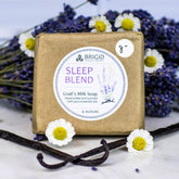 goats milk soap natural by brigid trading company sleep blend scent hand milled lavender chamomile vanilla image shows dried lavender and chamomile with vanilla on neutral detail with bar of soap kitsap county washington state